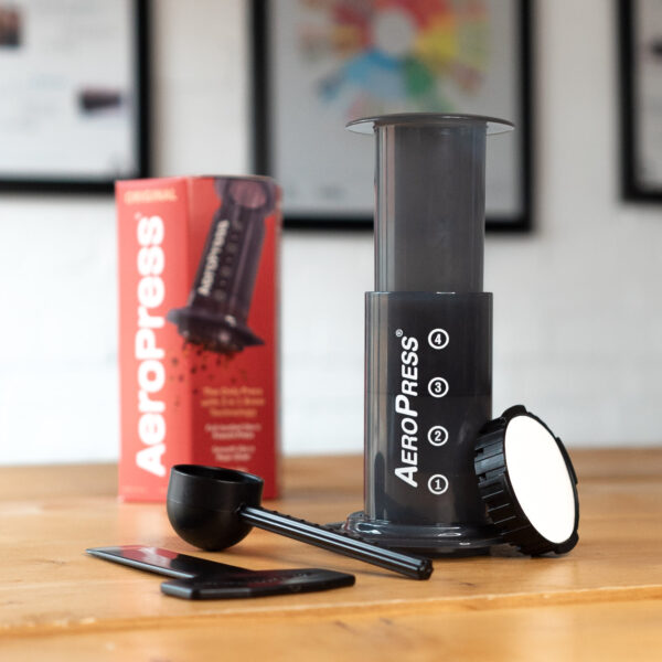 aeropress and box showing contents on a table