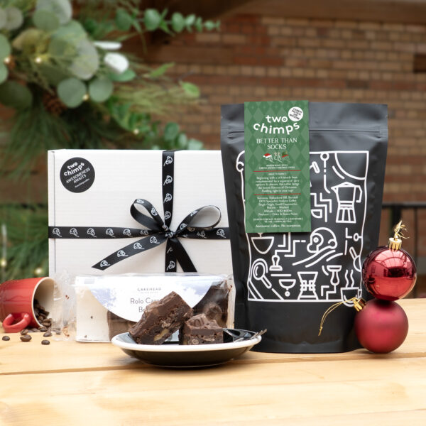 Christmas Coffee and Cakehead Brownies on a table with baubles