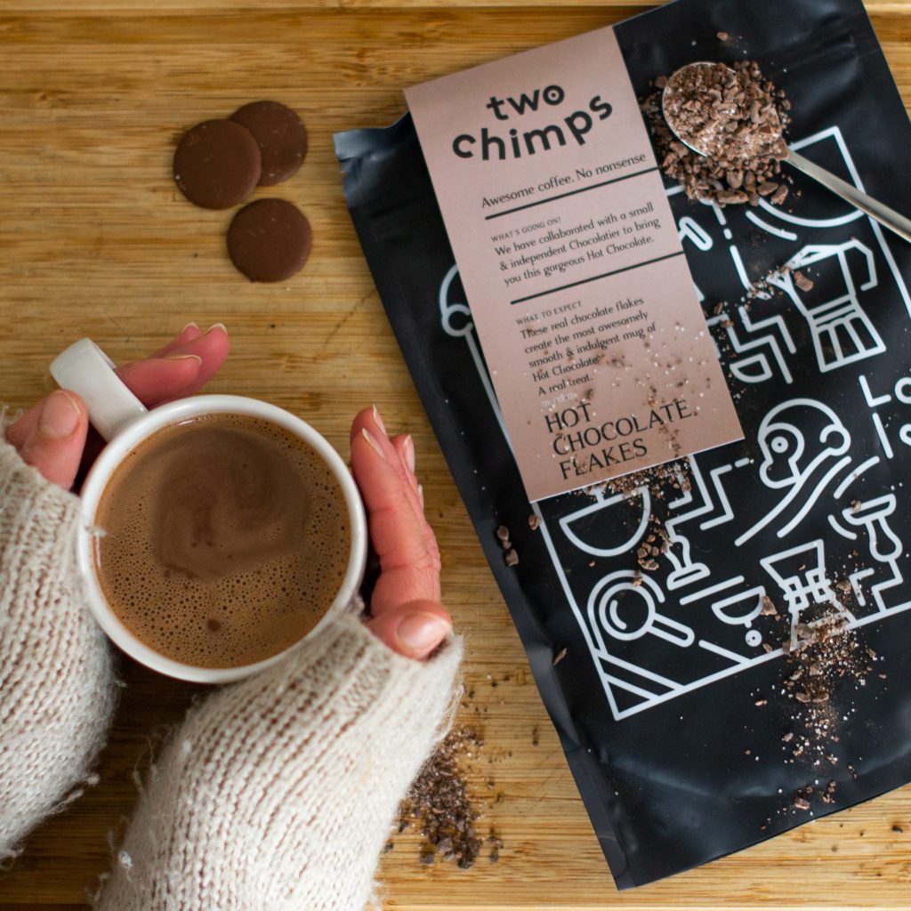 holding a cup of hot chocolate