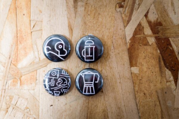 four two chimps badges on wood