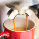 Espresso coming out of coffee machine