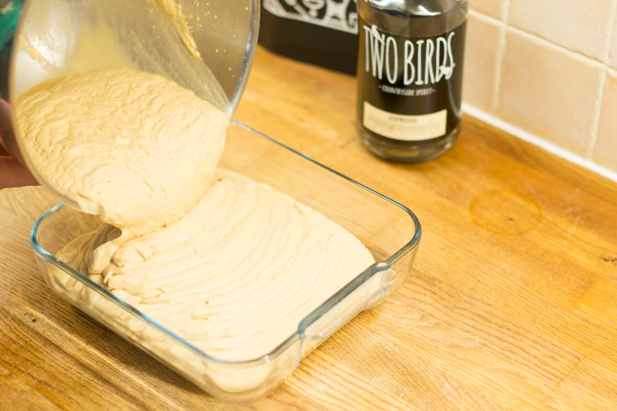 Pouring mixture into tray