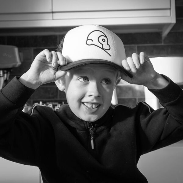 Felix wearing child sized cap