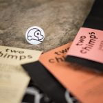 close up of three bags of coffee and two chimps magnet