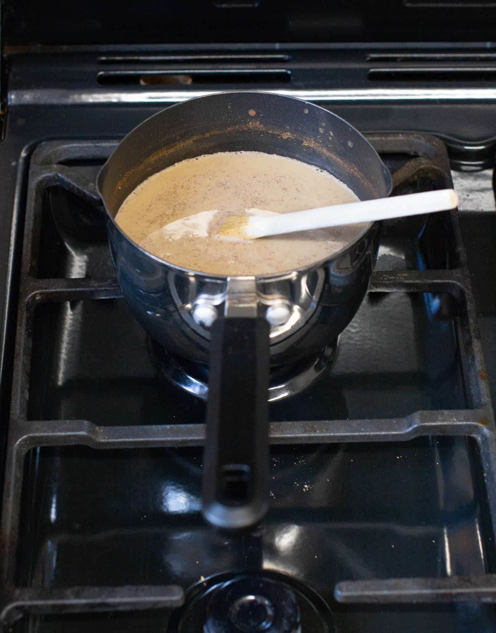 Pan with pumpkin coffee mix over heat