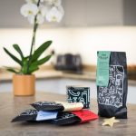four bags of coffee and a tin for advent by two chimps coffee