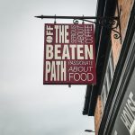 off the beaten path coffee shop sign