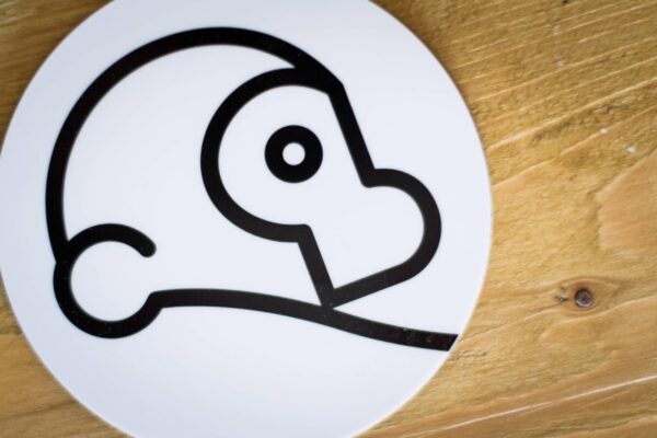 close up of a white two chimps coffee coaster