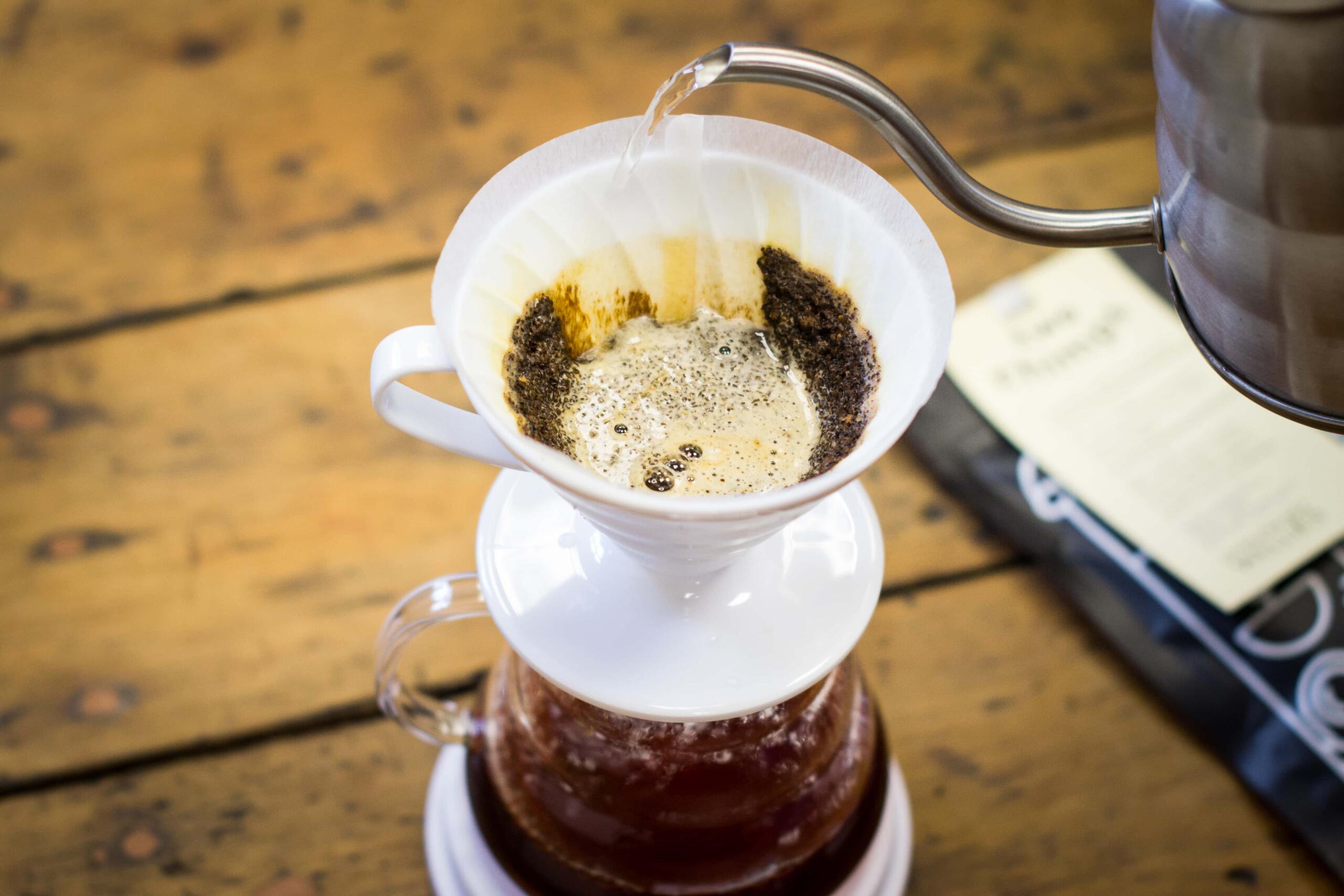 Pouring water into a v60 coffee dripper 