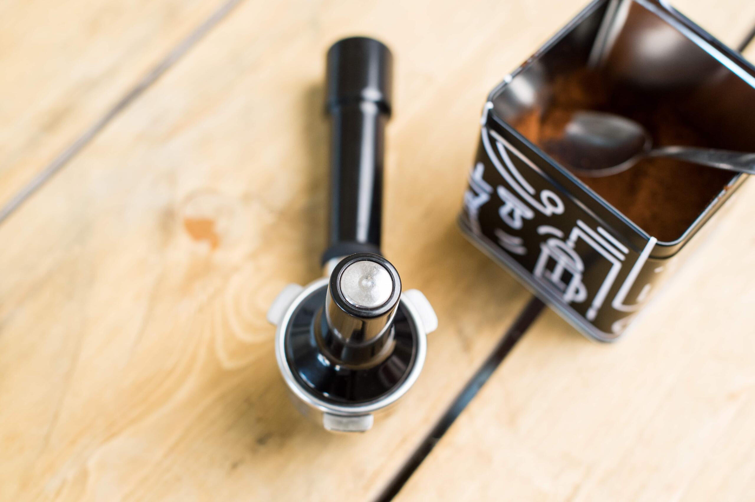 tamping coffee into a portafilter