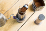 An aeropress being filled with coffee