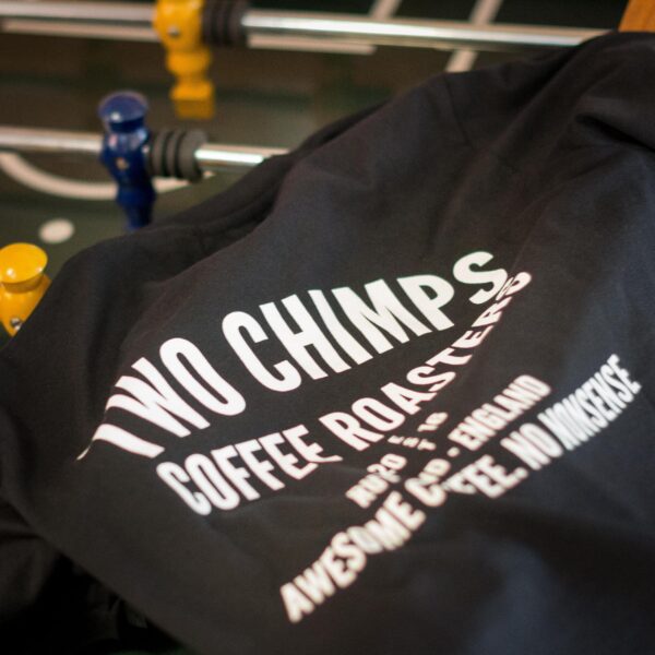 two chimps tshirt on a foose ball table