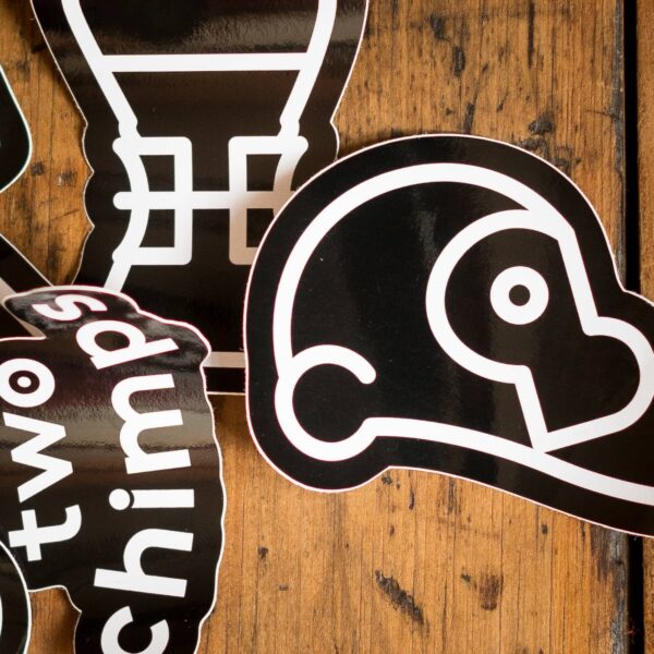 Two Chimps Coffee Stickers on a table