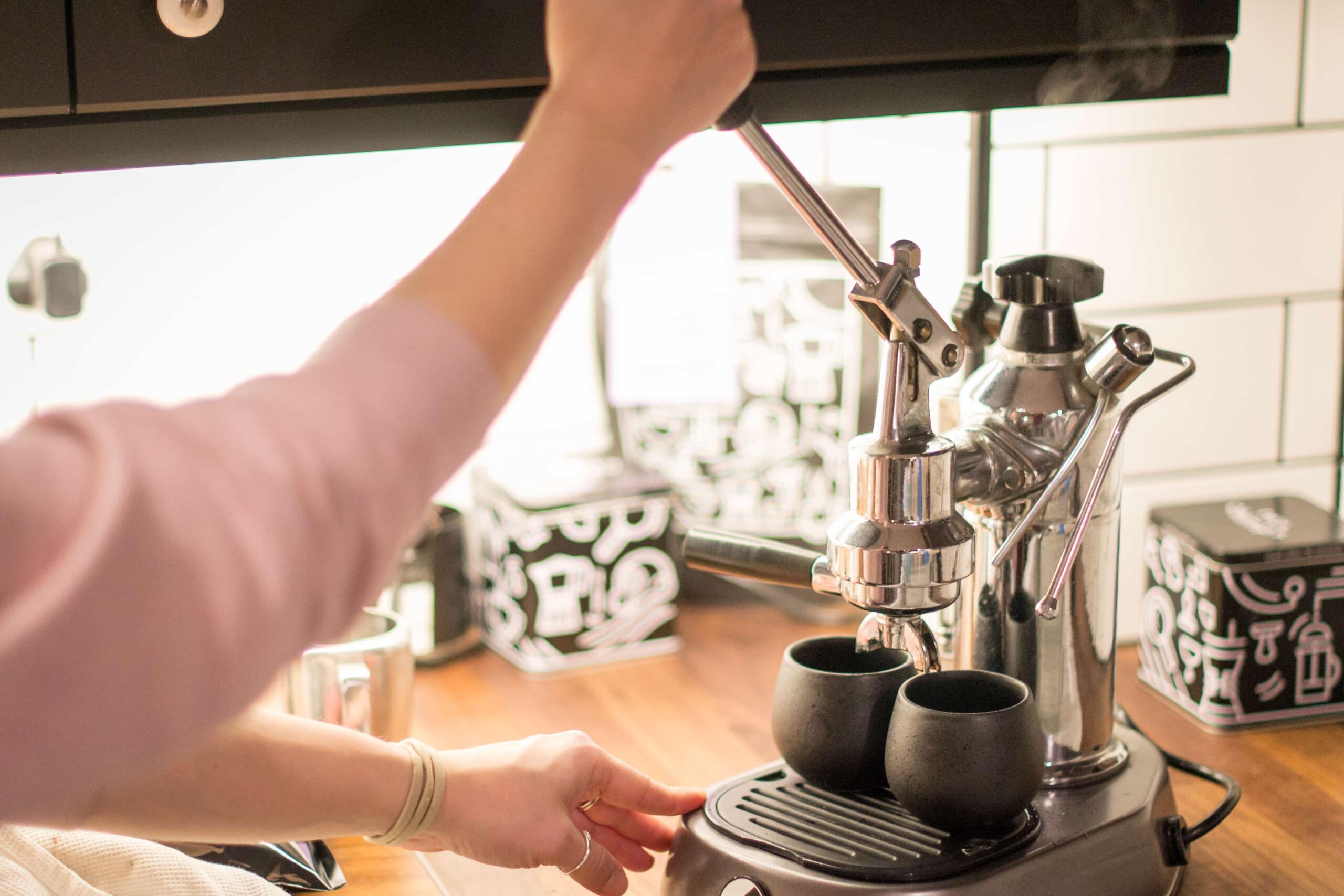 pulling a shop of espresso on a manual lever espresso machine