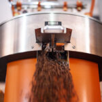 Coffee beans coming out of roaster