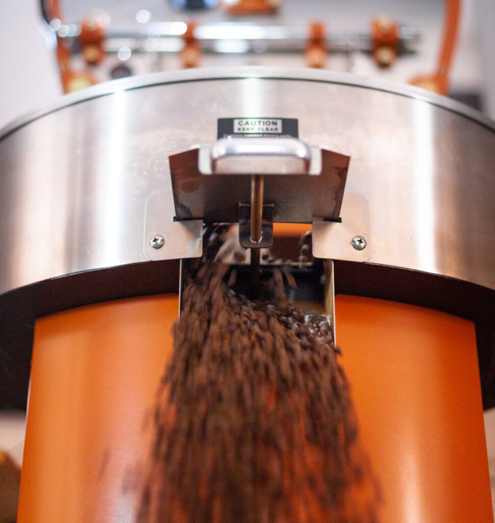 Coffee beans coming out of roaster