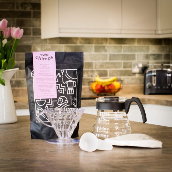 unboxed hario v60 pour over kit with a bag of two chimps coffee on a kitchen worktop