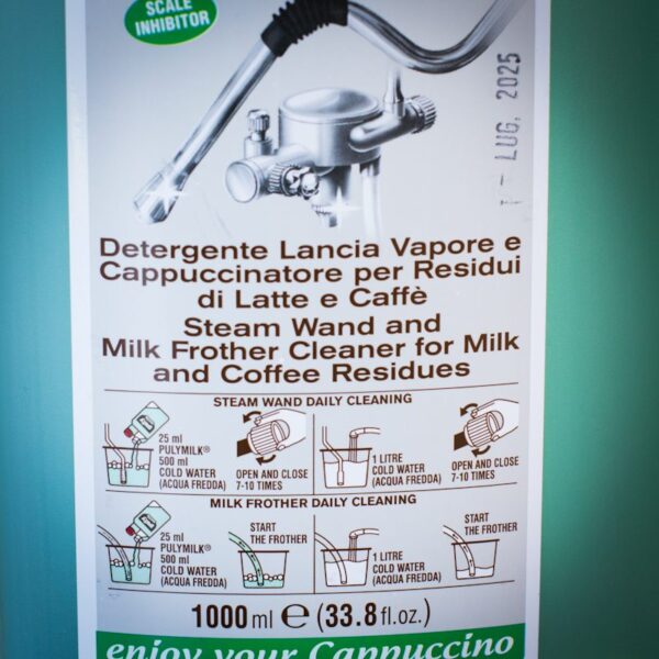 close up of puly milk frother wand cleaning solution