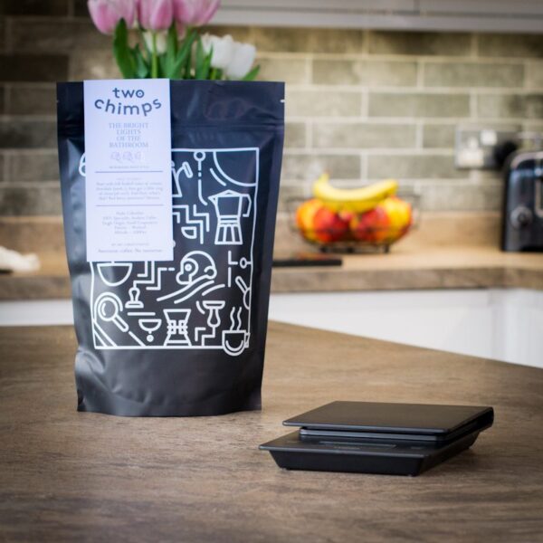 Unboxed hario v60 drip scales with a bag of two chimps coffee on a kitchen worktop