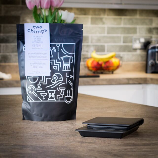 Unboxed hario v60 drip scales with a bag of two chimps coffee on a kitchen worktop