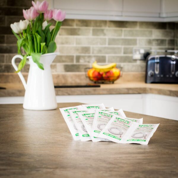 unboxed puly coffee grinder cleaning crystals on kitchen worktop