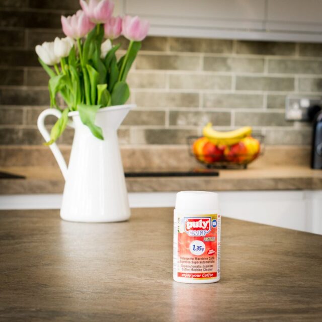 puly caff coffee machine cleaning tablets on kitchen worktop