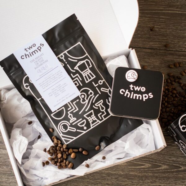 two chimps coffee tin and magnet with a bag of two chimps coffee in a white presentation gift box