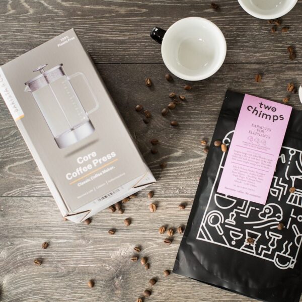 birdseye view of boxed cafetiere and a bag of two chimps coffee on a wooden table