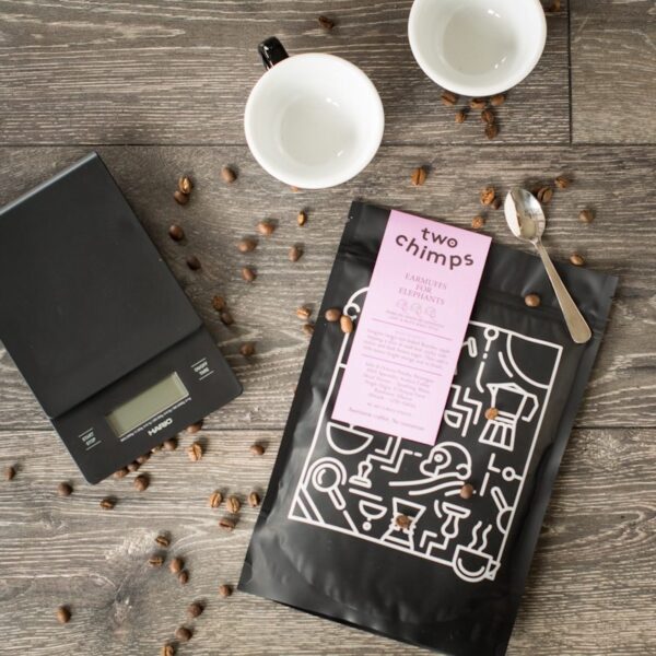 birdseye view of hario drip scales and a bag of two chimps coffee on a wooden table