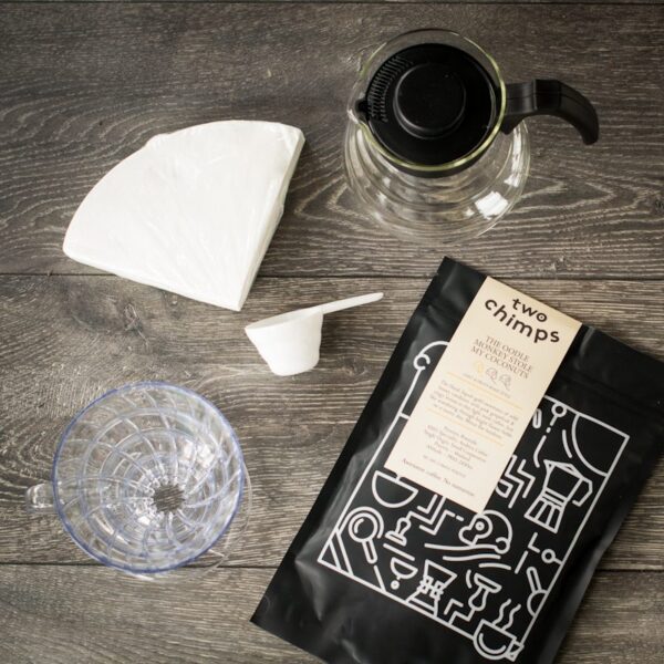 birds eye view of hario pour over kit with a bag of two chimps coffee on a wooden table