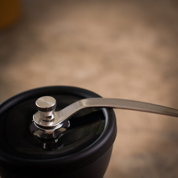 Close up of hand grinder available to purchase from the Two Chimps shop