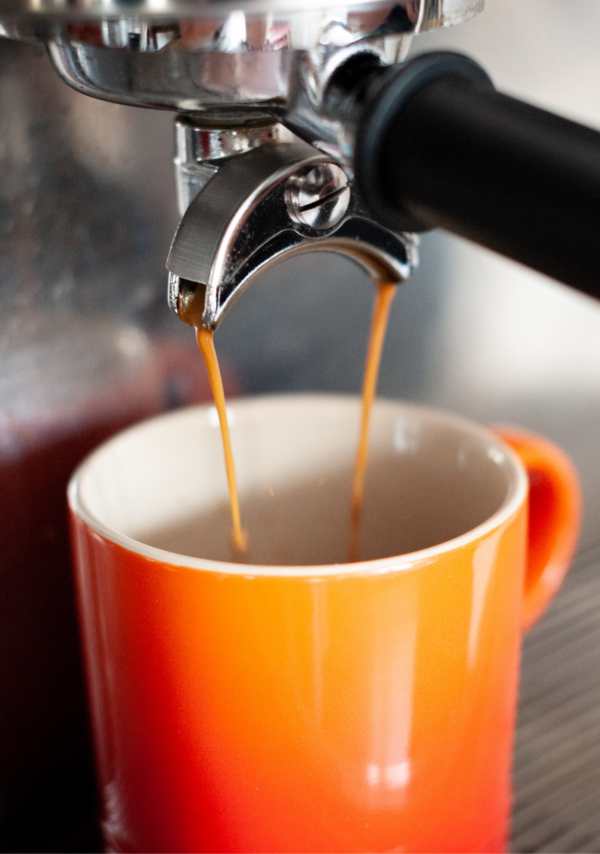 Coffee coming out of espresso machine